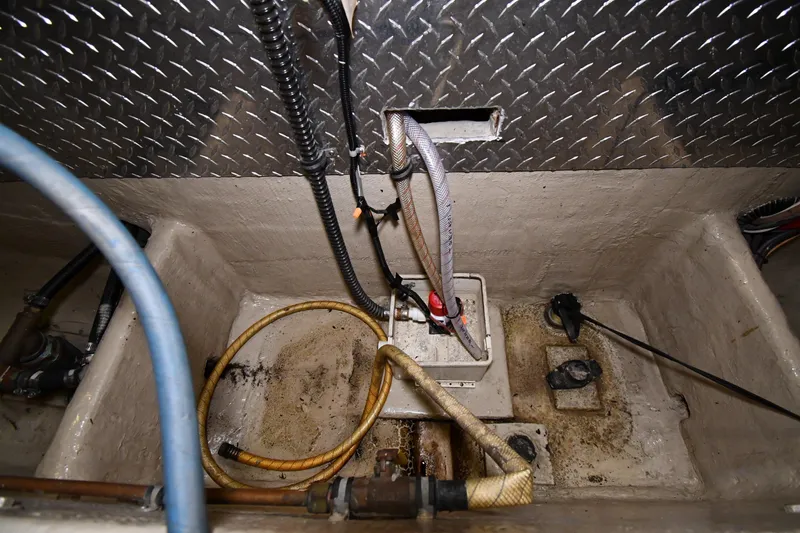 Patience III Yacht Photos Pics Bilge area of 1988 Viking 48 Convertible boat with hoses and wiring.