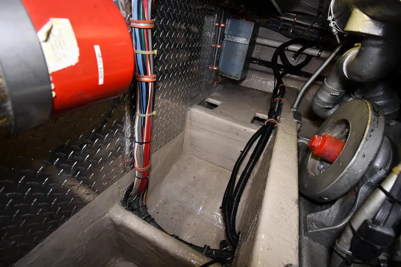 Patience III Yacht Photos Pics Engine room of 1988 Viking 48 Convertible boat, showing wiring and mechanical components.