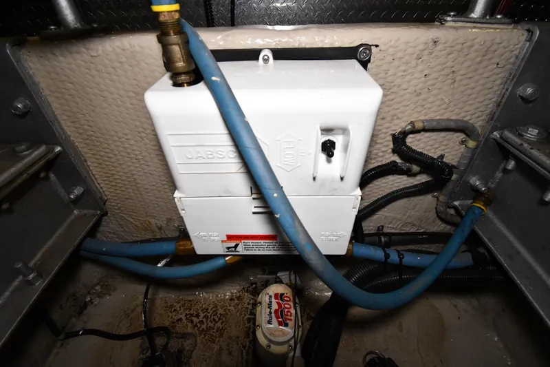 Patience III Yacht Photos Pics Engine room of 1988 Viking 48 Convertible with plumbing and electrical components.