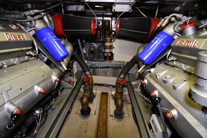 Patience III Yacht Photos Pics Engine room of 1988 Viking 48 Convertible with Detroit Diesel engines and blue filters.