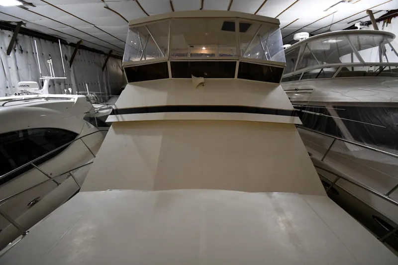 Patience III Yacht Photos Pics Viking 48 Convertible 1988 in storage facility, front view.