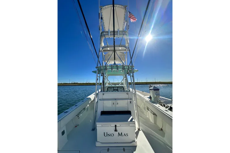 Uno Mas Yacht Photos Pics 2013 SeaVee 39B Center Console boat on water under clear blue sky.