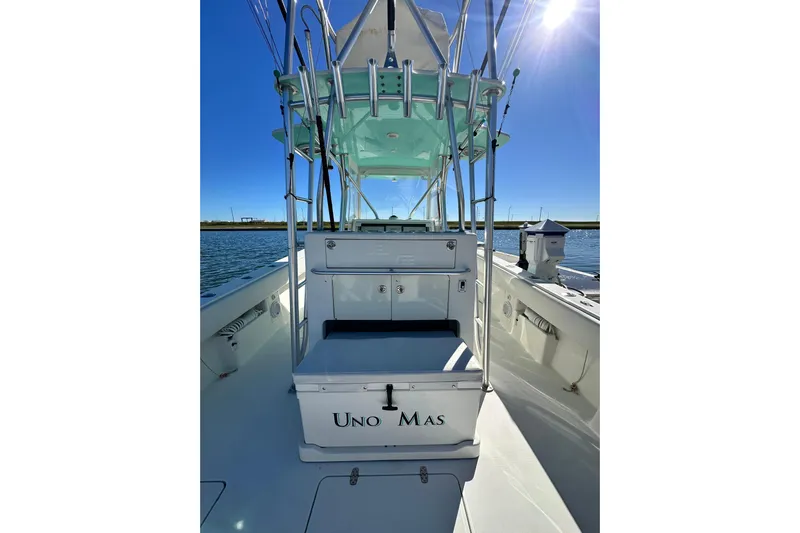 Uno Mas Yacht Photos Pics 2013 SeaVee 39B Center Console boat on water, sunny day, clear sky.