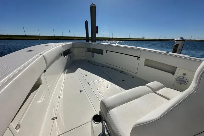 Uno Mas Yacht Photos Pics 2013 SeaVee 39B Center Console boat interior, featuring spacious seating and storage compartments.