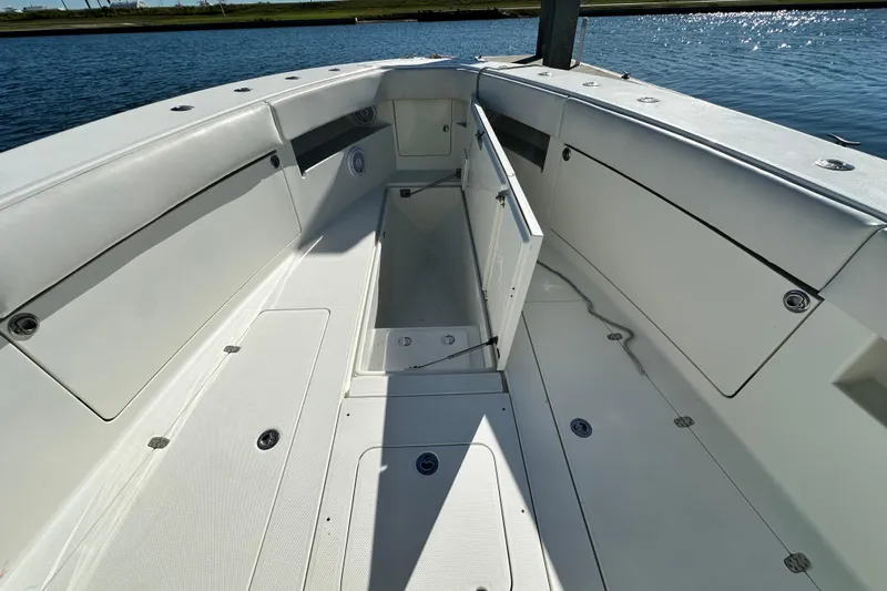 Uno Mas Yacht Photos Pics 2013 SeaVee 39B Center Console boat interior with open storage compartment.