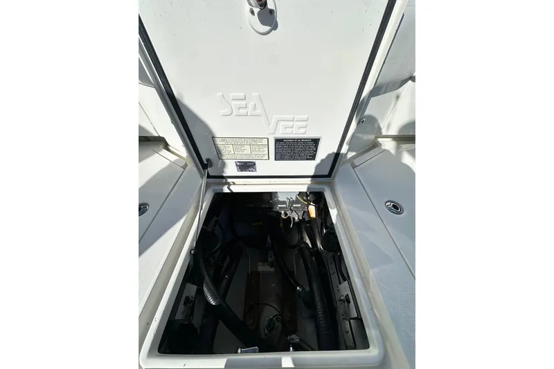 Uno Mas Yacht Photos Pics 2013 SeaVee 39B Center Console boat compartment with open hatch and visible wiring.