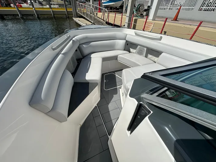  Yacht Photos Pics 2022 Aviara AV 32 OB boat with spacious seating and modern design at a dock.