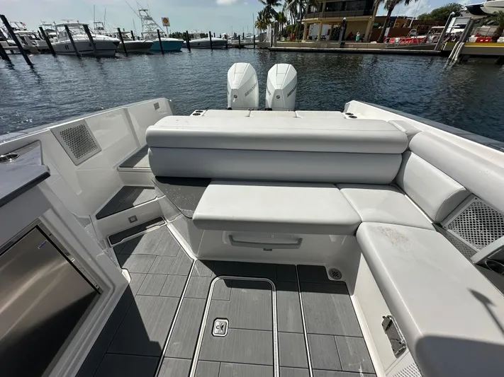  Yacht Photos Pics 2022 Aviara AV 32 OB boat interior with seating and twin outboard motors.