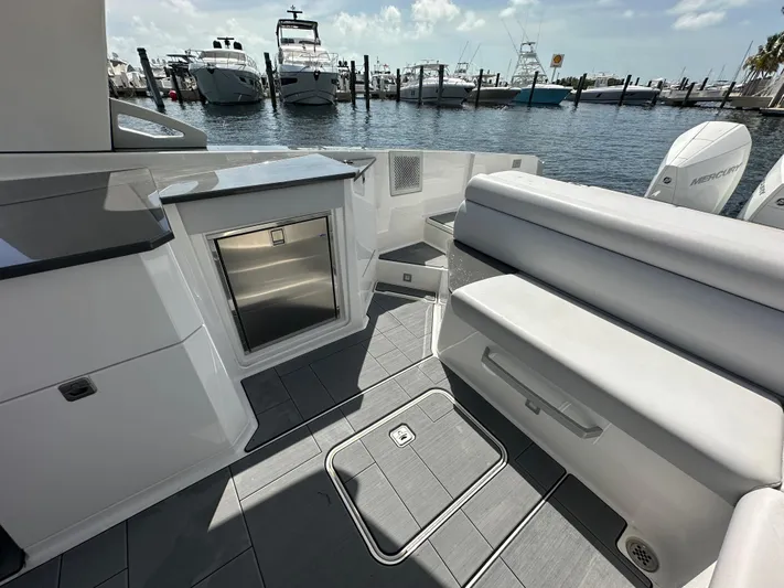  Yacht Photos Pics 2022 Aviara AV 32 OB boat interior with seating and storage, docked at marina.