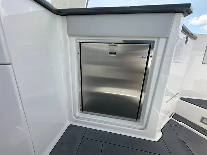 Yacht Photos Pics Stainless steel refrigerator on 2022 Aviara AV 32 OB boat deck.