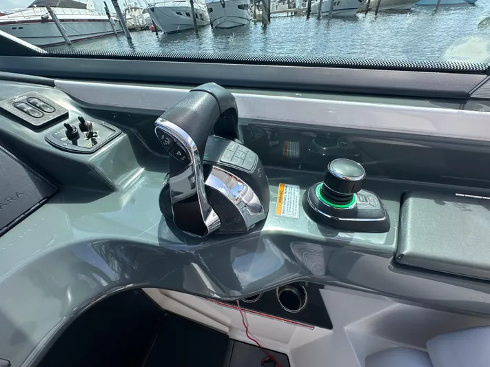  Yacht Photos Pics 2022 Aviara AV 32 OB boat control panel with throttle and joystick at marina.