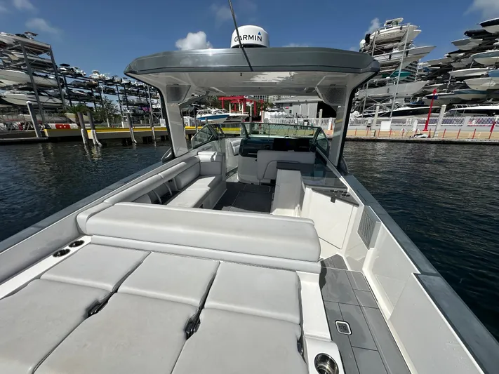  Yacht Photos Pics 2022 Aviara AV 32 OB boat with spacious seating and modern design at a marina.