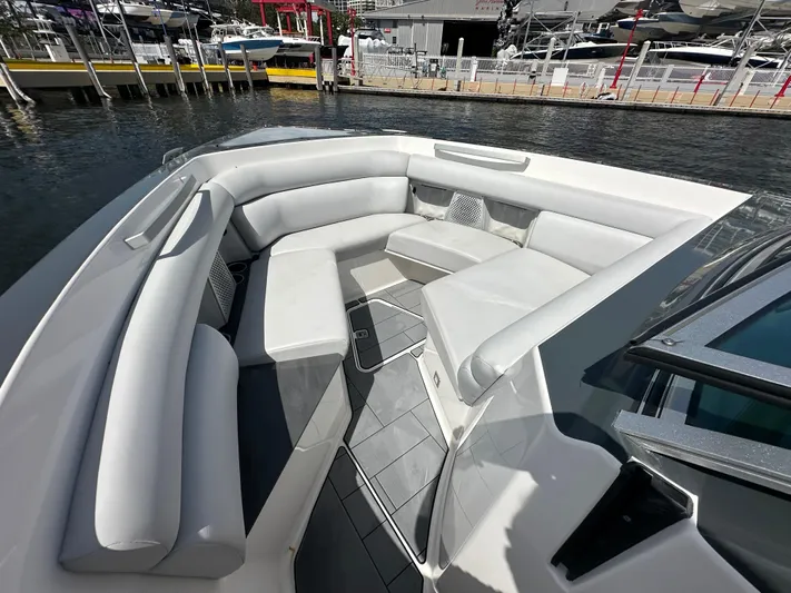  Yacht Photos Pics Luxurious seating area on 2022 Aviara AV 32 OB boat, docked at marina.