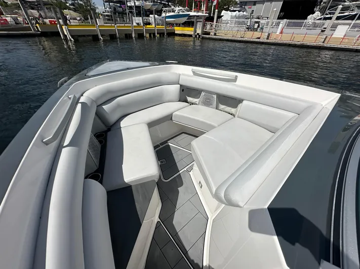  Yacht Photos Pics 2022 Aviara AV 32 OB boat with spacious seating area, docked by the water.
