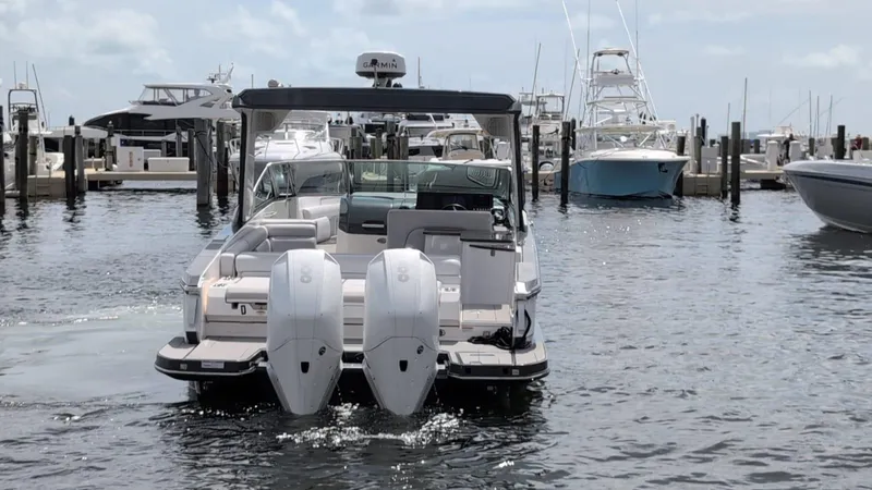 Yacht Photos Pics 2022 Aviara AV 32 OB boat docked at marina, featuring dual outboard engines.