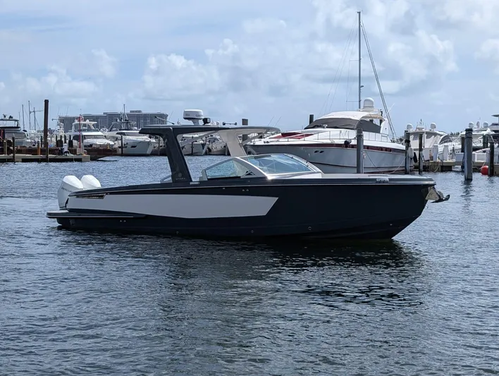  Yacht Photos Pics 2022 Aviara AV 32 OB boat docked in a marina, surrounded by other vessels.