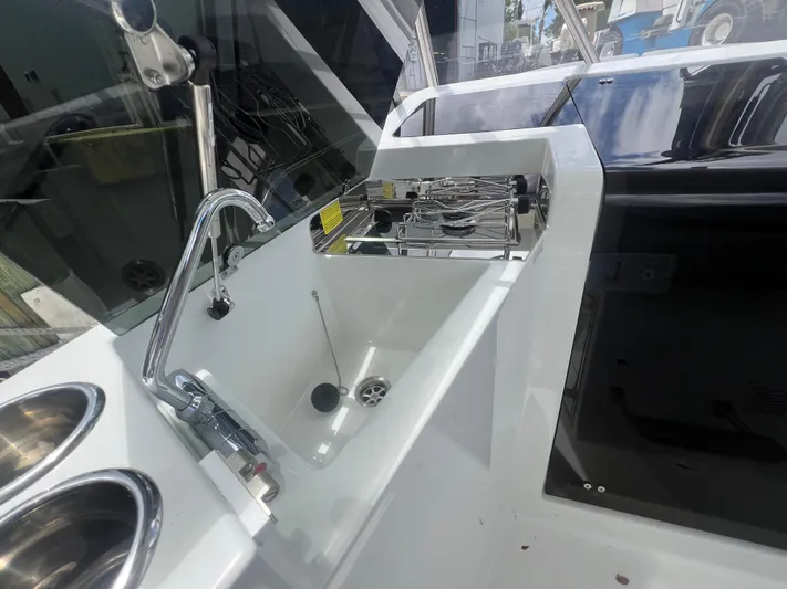  Yacht Photos Pics 2025 Beneteau Flyer 9 SUNdeck boat kitchen area with sink and stove.