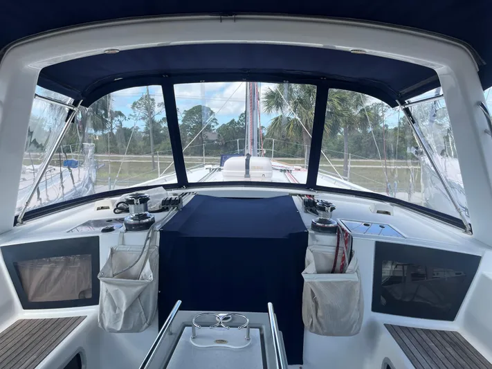 Drift Yacht Photos Pics Cockpit view of 2015 Beneteau Oceanis 45 sailboat with covered helm and winches.