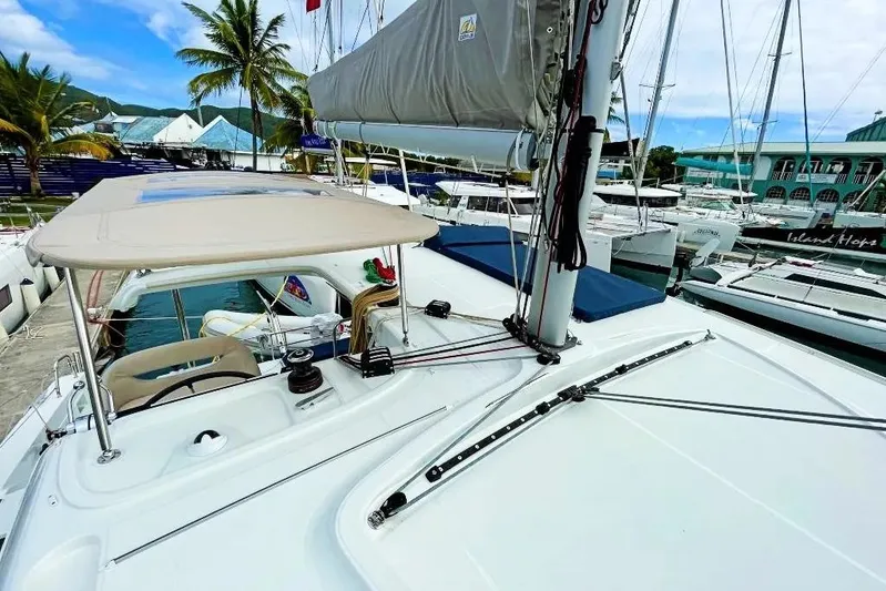 Noble Shadow Yacht Photos Pics 2022 Lagoon 40 catamaran docked at marina, featuring sleek design and spacious deck.