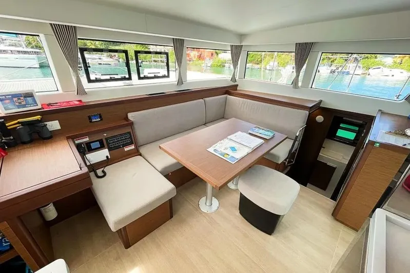 Noble Shadow Yacht Photos Pics Interior of 2022 Lagoon 40 catamaran with modern seating and navigation area.