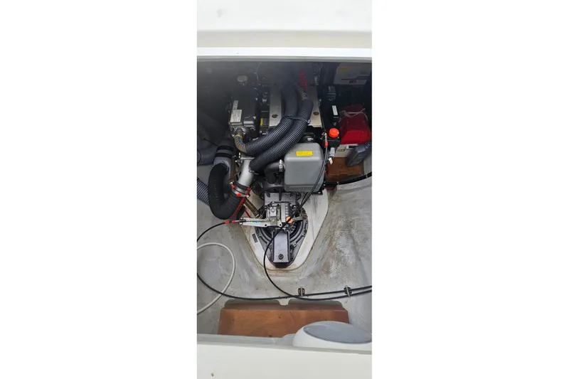 Noble Shadow Yacht Photos Pics Engine compartment of a 2022 Lagoon 40 catamaran, showcasing mechanical components and wiring.