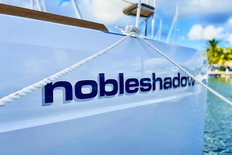 Noble Shadow Yacht Photos Pics Lagoon 40 catamaran "nobleshadow" docked, 2022 model, with clear blue sky background.