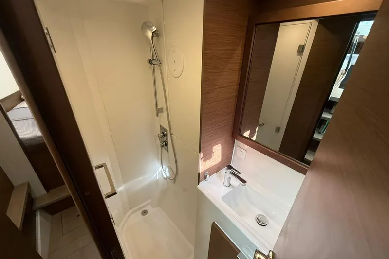 Noble Shadow Yacht Photos Pics Bathroom interior of 2022 Lagoon 40 yacht with shower and sink.