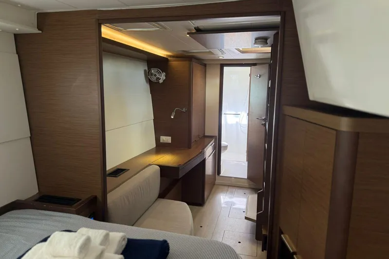 Noble Shadow Yacht Photos Pics Luxurious interior of 2022 Lagoon 40 yacht cabin with modern amenities and elegant design.