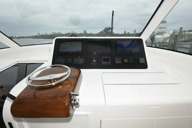 Galati Yacht Sales Trade Yacht Photos Pics 2022 Viking 44 Sport Coupe dashboard with navigation controls and display screens.