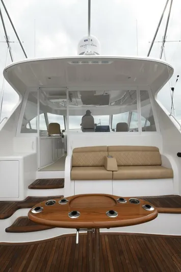 Galati Yacht Sales Trade Yacht Photos Pics 2022 Viking 44 Sport Coupe yacht with sleek design and luxurious seating area.