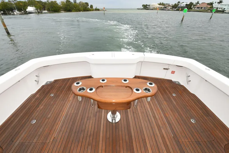 Galati Yacht Sales Trade Yacht Photos Pics 2022 Viking 44 Sport Coupe yacht with teak deck and fishing station on open water.