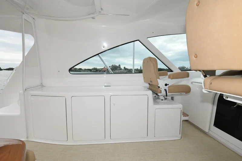 Galati Yacht Sales Trade Yacht Photos Pics Interior of 2022 Viking 44 Sport Coupe yacht with beige seating and sleek design.