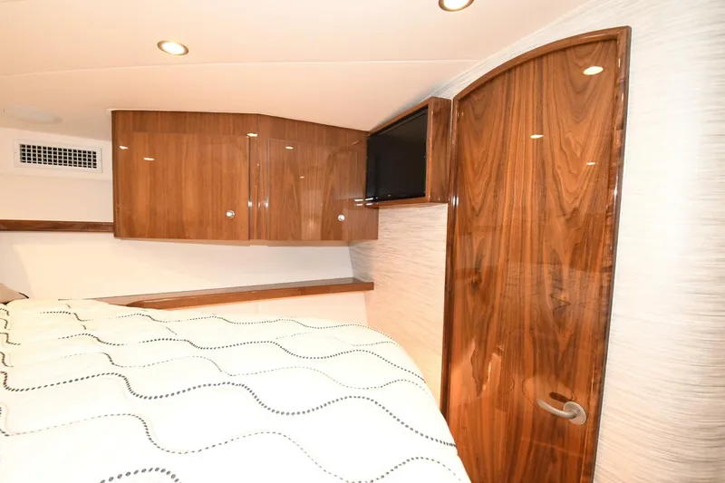 Galati Yacht Sales Trade Yacht Photos Pics 2022 Viking 44 Sport Coupe interior with wood cabinetry and modern design.