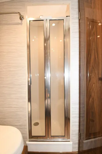 Galati Yacht Sales Trade Yacht Photos Pics Shower area in 2022 Viking 44 Sport Coupe yacht with glass doors.
