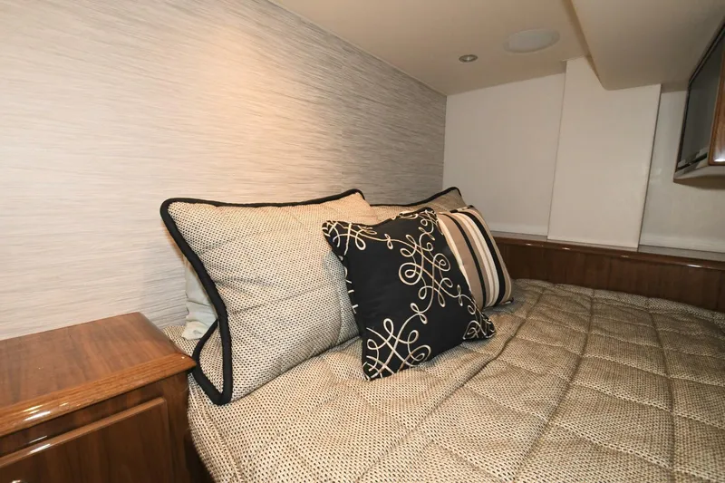 Galati Yacht Sales Trade Yacht Photos Pics Luxurious cabin interior of 2022 Viking 44 Sport Coupe with elegant bedding and cushions.