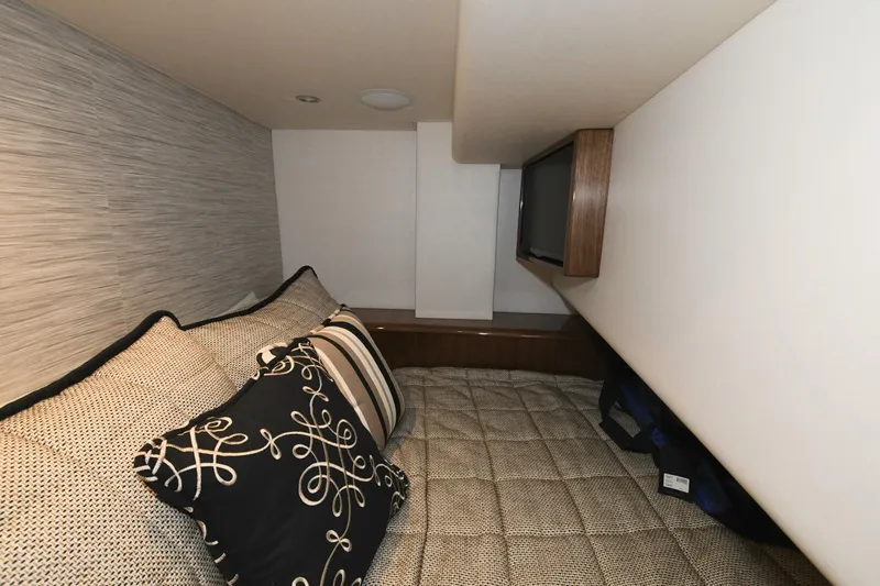Galati Yacht Sales Trade Yacht Photos Pics Interior cabin of 2022 Viking 44 Sport Coupe with cozy bedding and TV.