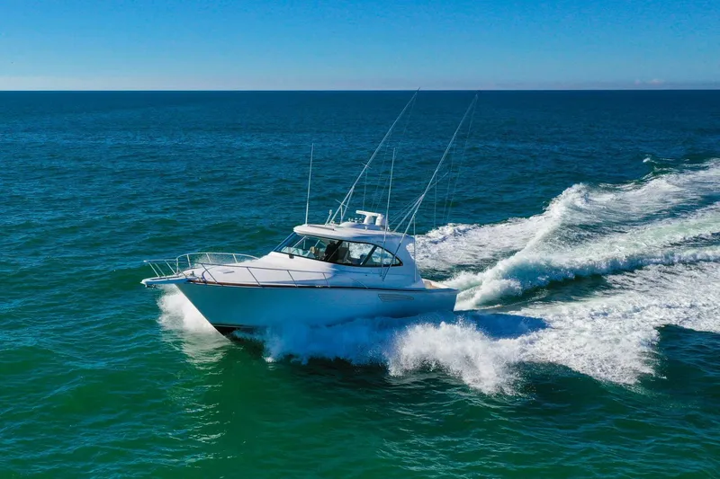 Galati Yacht Sales Trade Yacht Photos Pics 2022 Viking 44 Sport Coupe cruising on open ocean waters.