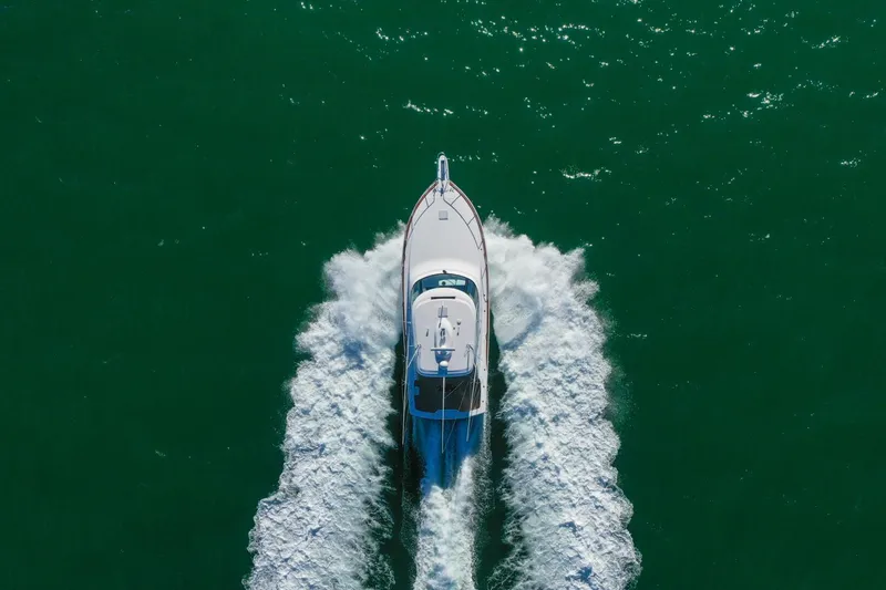 Galati Yacht Sales Trade Yacht Photos Pics 2022 Viking 44 Sport Coupe cruising on open water, aerial view.