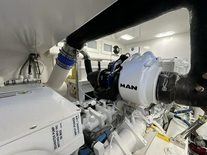Galati Yacht Sales Trade Yacht Photos Pics Engine room of 2022 Viking 44 Sport Coupe with MAN engine components.