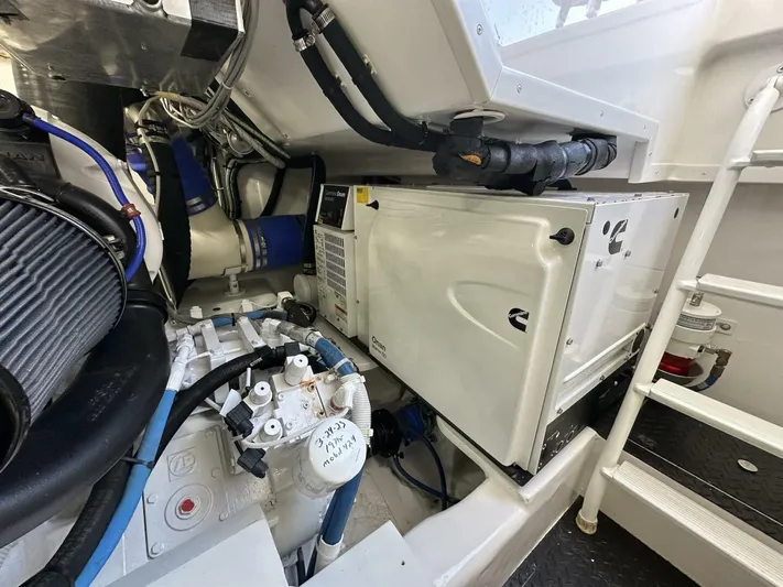 Galati Yacht Sales Trade Yacht Photos Pics Engine room of 2022 Viking 44 Sport Coupe, showcasing mechanical components and systems.
