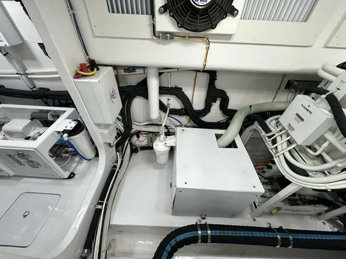 Galati Yacht Sales Trade Yacht Photos Pics Engine room of 2022 Viking 44 Sport Coupe, showcasing complex wiring and mechanical components.