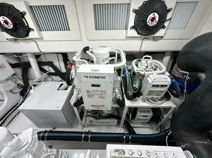 Galati Yacht Sales Trade Yacht Photos Pics Engine room of 2022 Viking 44 Sport Coupe with Dometic equipment and ventilation system.