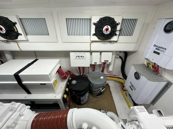 Galati Yacht Sales Trade Yacht Photos Pics Engine room of a 2022 Viking 44 Sport Coupe with electrical components and wiring.