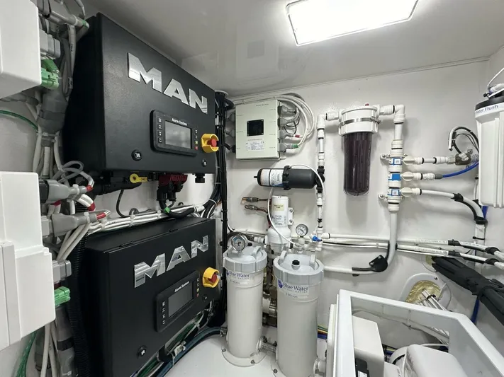 Galati Yacht Sales Trade Yacht Photos Pics Engine room of 2022 Viking 44 Sport Coupe with MAN systems and filtration units.