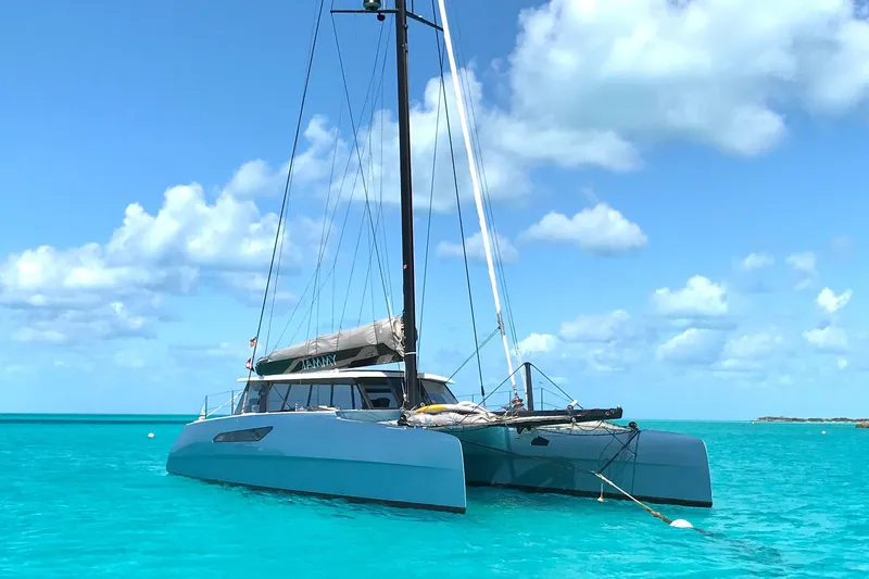Jammy Yacht Photos Pics 2015 Gunboat 57' catamaran sailing on clear turquoise waters under a blue sky.