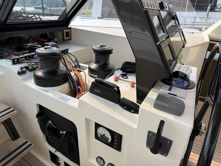 Jammy Yacht Photos Pics Control panel of a 2015 Gunboat 57' yacht with navigation instruments and winches.
