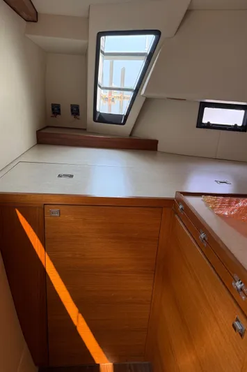 Jammy Yacht Photos Pics Interior of 2015 Gunboat 57' yacht with wooden cabinetry and modern design.