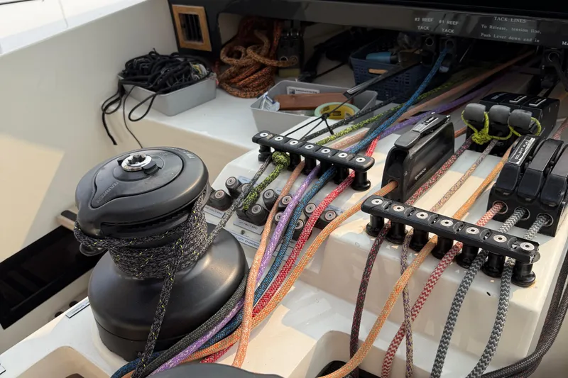 Jammy Yacht Photos Pics Sailing yacht control panel with colorful ropes, winch, and cleats on a 2015 Gunboat 57'.