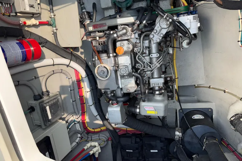 Jammy Yacht Photos Pics Engine compartment of a 2015 Gunboat 57' yacht, showcasing mechanical components and wiring.