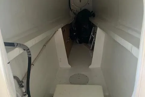 Jammy Yacht Photos Pics Interior view of a 2015 Gunboat 57' yacht, showcasing a narrow passageway.